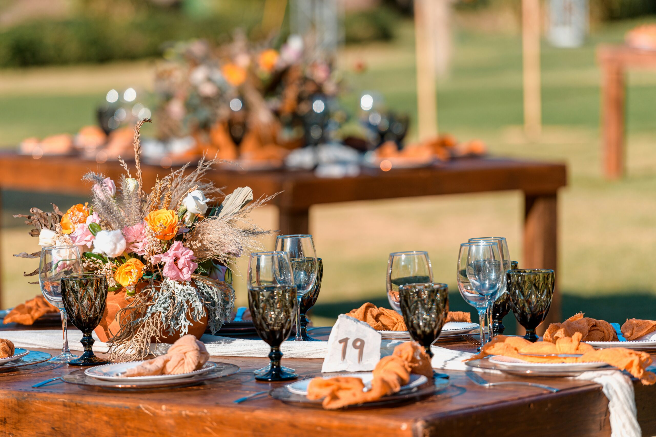 Wedding table decorations and flowers with dinnerware.